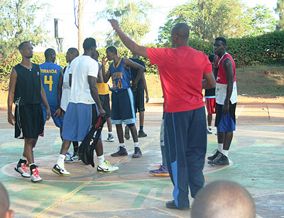 Espoir coach Jean Bahufite (right) takes his players through a training session last season. Times Sport / File.