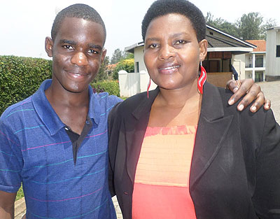 Edisa Umutesi, Mugishau2019s mother, could not miss a photo opportunity with her son after he was declared third best student in Rwanda.  Education Times/Photo by P. Kabeera