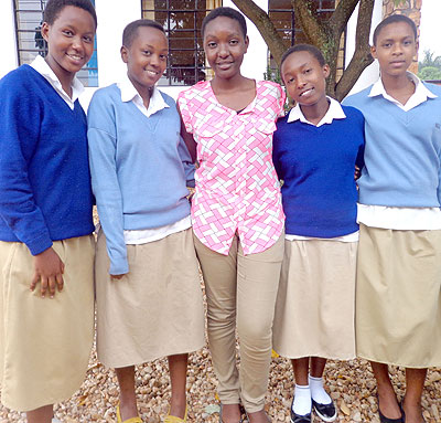 Ashimwe (centre) is congratulated by students of her former school, Lycu00e9e Notre Dame de Citeaux. Education Times/Photo by Jean de la Croix Tabaro 