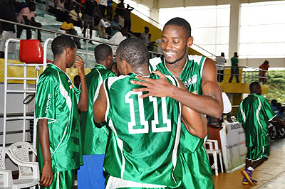 Espoir's forward Olivier Shyaka (facing camera) congratulates his teammate Pascal Karekezi at the end of Game Four of last season's playoff final against KBC.