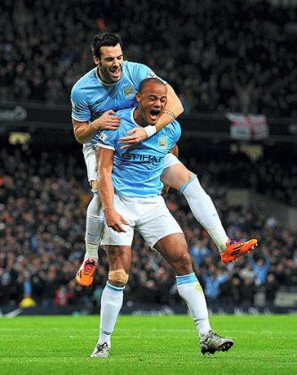 Vincent Kompany and Alvaro Negredo of Manchester City seem tpo be enjoying the moment as their team chaces a unique quadraple. Net photo