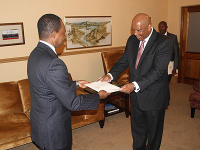 Amb. Karega (L) presenting his credentias to the King of Lesotho. Sunday Times/Courtesy
