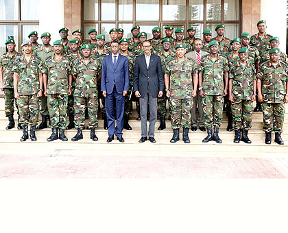 President Kagame (centre) and Defence minister James Kabarebe (to his right) and Chief of Defence Staff Gen. Patrick Nyamvumba (to the Presidentu2019s left) in a group photo with Rwanda Defence Forces top brass shortly after the Defence Retreat  in Kigali yesterday. The New Times/ Village Urugwiro.