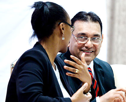 Lobo (R) chats with Kayitesi during the meeting between Indian investors and RDB in Kigali yesterday. The New Times/ Timothy Kisambira.
