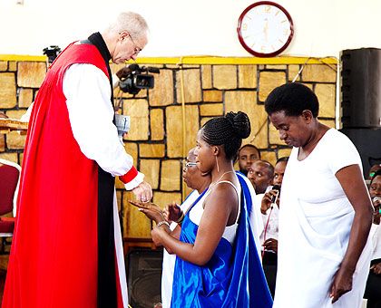  Archbishop Welby conducts Holy Communion at St. Etienne Anglican Church of Rwanda in Kigali yesterday. The New Times/ Timothy Kisambira.