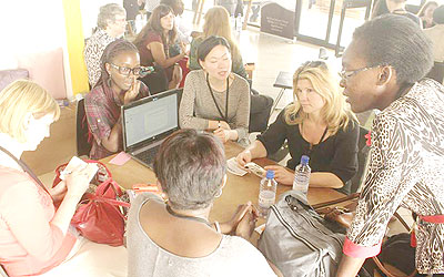 Women representatives from Silicon Valley discuss with girls active in ICT at the seminar. The New Times/ C. Mwai.