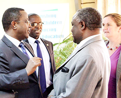 From L-R; Education minister Vincent Biruta, State minister for Primary and Secondary Education Mathias Harebamungu, Prof. George Njoroge, the principal of College of Education, and Unicefu2019s Noala Skinner chat after the meeting yesterday. John Mbanda.