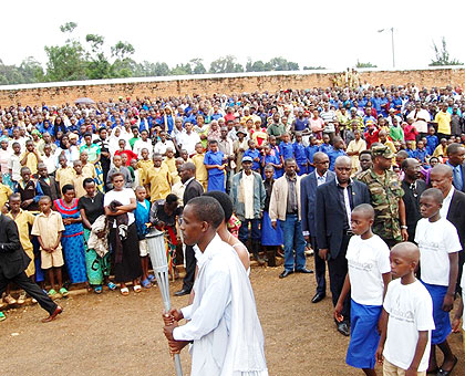 Hundreds of residents pay their respects as the Kwibuka Flame arrives in Rusizo District yesterday. JP Bucyensenge.