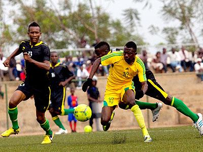 AS Kigali striker Bodo Ndikumana, seen battling for the ball against Academie Tchite defender Omar Ngando, scored the vital goal for the Kigali City sponsored side yesterday at Sta....