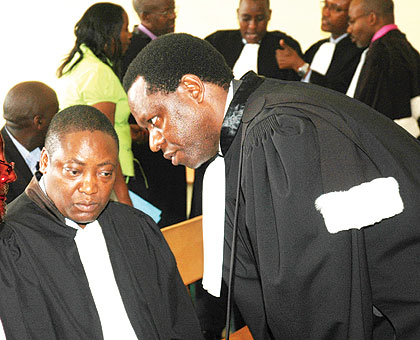 Advocates consult in court during a past hearing. Some activists have questioned the rationale of increasing the court fees. File.