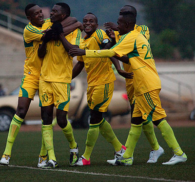Striker Bodo Ndikumana #10, is mobbed by his teammates after scoring the only goal of the game as AS Kigali beat Academie Tchite of Burundi in the first leg on Saturday. Timothy Kisambira.