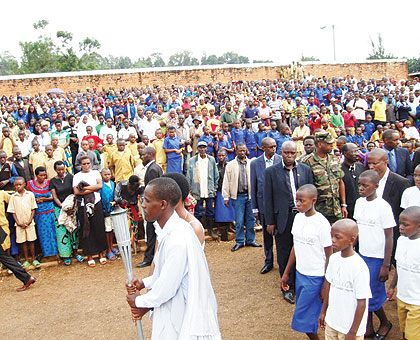 The Kwibuka Flame as it arrived in Rusizi stadium last Friday. Residents stood up in respect as the Flame made its way into the stadium where hundreds of Tutsis were killed during ....