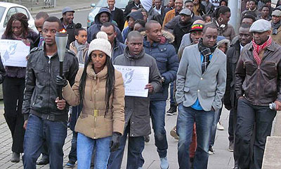 Two 20-year-olds carry the Kwibuka Flame as it arrived in Midlands, UK. The Flame started in London, then  Oxford, Reading and Coventry.  Courtesy.
