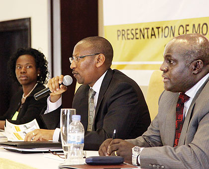 Central bank governor John Rwangombwa (centre), vice governor Monique Nsanzabaganwa (left) and the banku2019s chief economist, Thomas Kigabo, at the presentation of the Monetary Policy and Financial Stability Statement in Kigali. Timothy Kisambira