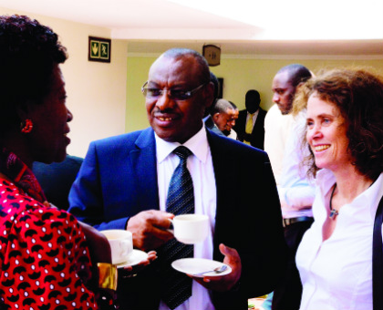 Finance minister Amb. Claver Gatete (C) chats with MP Constance Rwaka Mukayuhi (L) and Carolyn Turk, the World Bank country manager at the Government-Development Partners meet in Rubavu yesterday. Timothy Kisambira.