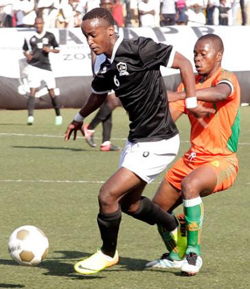 Yannick Mukunzi, left, seen here against Gicumbi in the first round match, is expected to start in APR midfield in the absence of suspended Andrew Buteera. Timothy Kisambira