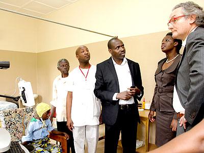 Jean-Pascal Labille (R) together with Dr Anita Asiimwe, the state minister for health (2R) and the staff of Ndera. Courtesy