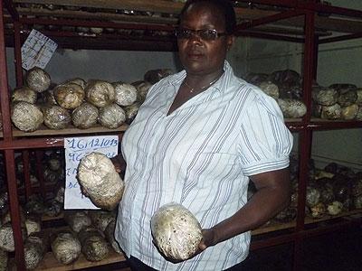 Niyibaho in one of her mushroom shops. After eight years of growing mushrooms, she is proud of her achievements. Seraphine Habimana