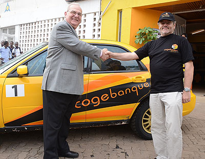 Chief Executive officer Alain Lepatre Lamontagne shakes hands with Davite Giancarlo after Cogebanque agreed to sponsor his continental bid of winning the 2014 ARC title. The New Ti....