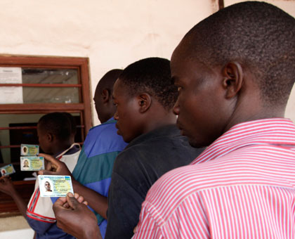 Citizens present their national IDs at the Gatuna border this year. Foreigners are also set to get IDs to save them the burden of moving with passports.  File.