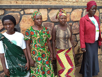 Beata Nyirabarushigorora (L), an instructor who has been volunteering for the past four years, poses with fellow trainers. Jean Pierre Bucyensenge