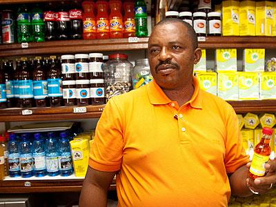 Sina explains the process of making one of his products. Moses Opobo