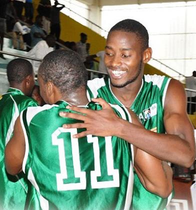 Espoir's forward Olivier Shyaka, right, hugs a teammate after a league game last season. Shyaka scored 30 points as Espoir won the opening game yesterday. File.