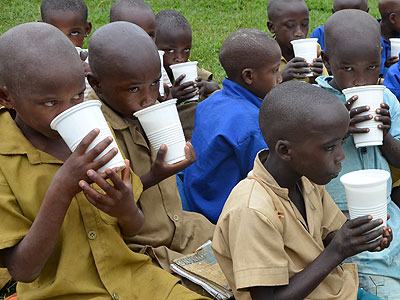  School children take milk in Bugesera District. Making milk available to children is one of the factors that have helped fight child mortality. File