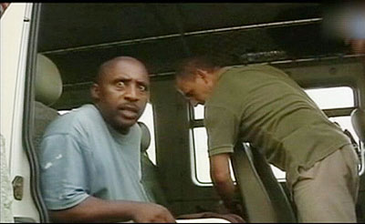 Simbikangwa being led to a French court in a wheelchair. Another French court this week overturned an extradition order involving two Genocide suspects and upheld an earlier ruling....