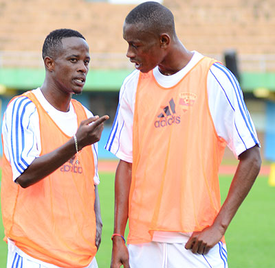 In the absence of Haruna Niyonzima (left), Jean Baptiste Mugiraneza (right) will be the likely candidate to captain Amavubi in Bujumbura. File