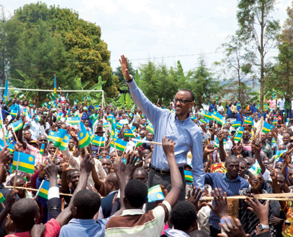 President Kagame waves to the residents of Rulindo District on his arrival  at Rutongo grounds yesterday.  Timothy Kisambira.