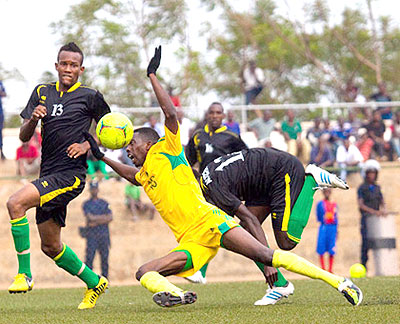 AS Kigali striker Bodo Ndikumana goes down after a challenge by an Academie Tchitu00e9 player at Stade de Kigali in the previous round.  Timothy Kisambira.