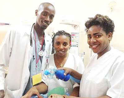 Dr Athanase (L) poses with nurses at Kibagabaga Hospital after training in neonatal resuscitation. Courtesy photo.