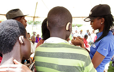 Patients receive hearing aids yesterday. John Mbanda