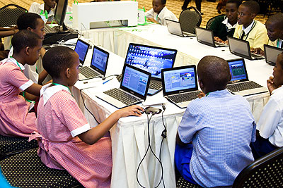 Pupils doing some work on their laptops. In Rwanda today, both girls and boys have access to the same facilities in schools. /Timothy Kisambira  