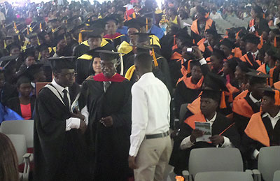 Officials arriving for the graduation ceremony on Saturday as excited graduands look on. /Samson Kasasira 