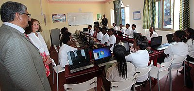 Rotary Club of Kigali-Virunga president Binu Malayil Tharian Thomas (left) and Akilah Institute principal Catherine Heaton visit the computer lab 
