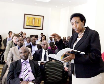 EALA legislator Patricia Hajabakiga comments on the report after the launch yesterday. John Mbanda. 