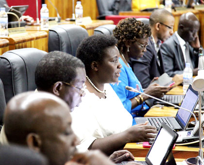 MP Marie Josu00e9e Kankera raises a point during the session at which Minister Gatete presented the revised National Budget for approval before Parliament yesterday. .John Mbanda. 