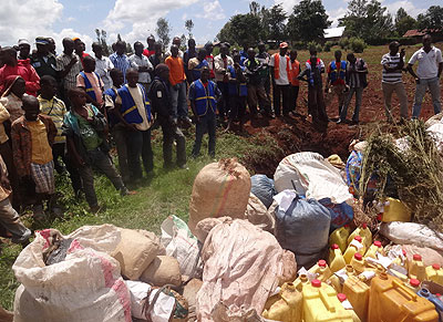 Residents witness destruction of the drugs in Kirehe District yesterday. Stephen Rwembeho.  