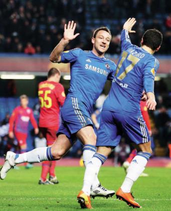 John Terry of Chelsea celebrates with Eden Hazard after the Belgian had scored in a previous game. Net Photo