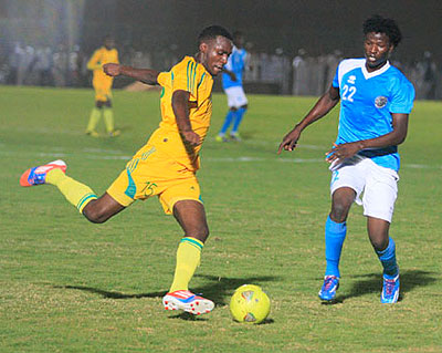 Defender Soter Kayumba, left, seen here challenging an Al Ahly Shendi striker, scored the winning penalty to help AS Kigali win 5-4 after a 1-all aggregate draw in the first round ....