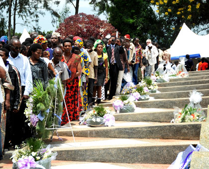 People pay tribute to Genocide victims at Rebero during a past event. Simbikwanga is accused of being a mastermind of the killing. File.