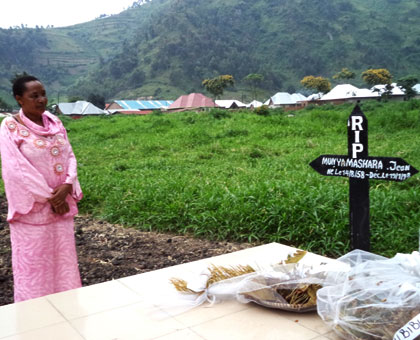 Nyirabaganzu stands near the grave of her former husband. Inset is a monument for victims. Jean Pierre Bucyensenge.