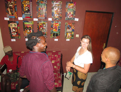 Attendees admire some of the pieces exhibited by Hakizimana in honour of women on Saturday. 