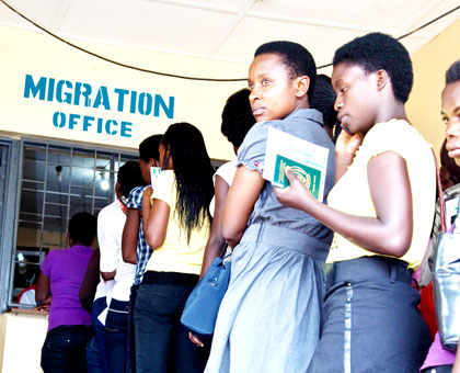 Travellers get clearance at the Rwanda- Tanzania border of Rusumo. (File)
