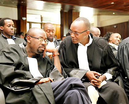 Lawyers consult during a past meeting. They are among the professionals the Office of the Ombudsman needs in its fight against corruption. (File)