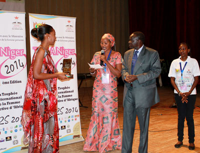 Rugwizangoga (left) receives her award at the ceremony held in Niger earlier this week. Courtesy.