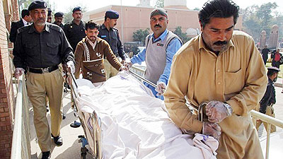 SEXUAL VIOLENCE. Pakistani paramedics and policemen move the body of a rape victim from a hospital in Multan. A Pakistani teenager died on March 14 after setting herself on fire af....