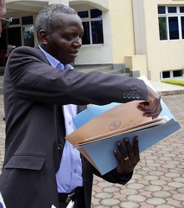 Edouard Munyamaliza delivering his Petition letter at the UN offices in Kigali. John Mbanda